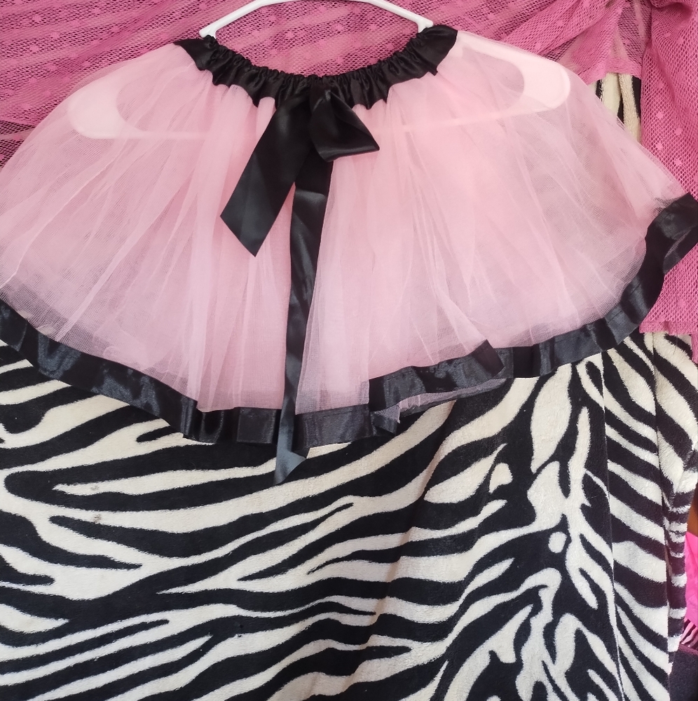 Light pink tutu with black sequin trim on top and bottom